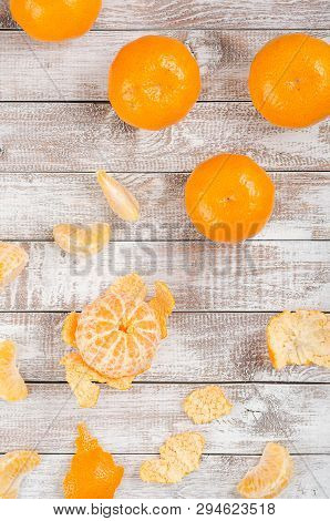 Peele Dripe Tangerines On Wooden Light Background