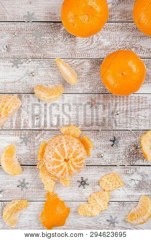 Peele Dripe Tangerines On Wooden Light Background