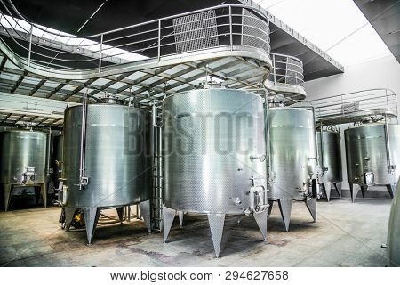 Some wine metallic fermentation tanks. Wine industry in winery Vina Undurraga in Talagante Chile. The foundation was established in 1885 by Don Francisco Undurraga.