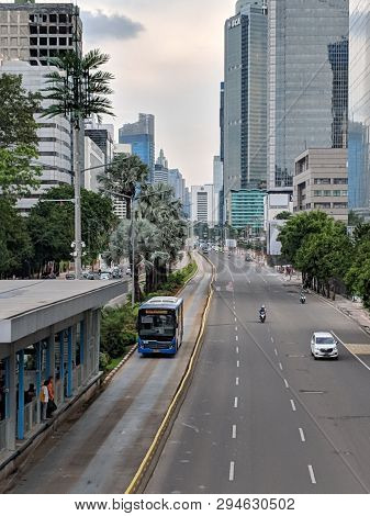 Jakarta, Indonesia - February 16, 2019: Transjakarta Bus Passing Through Jalan Thamrin (thamrin Stre