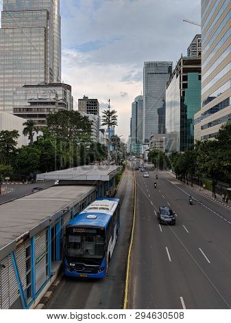 Jakarta, Indonesia - February 16, 2019: Transjakarta Bus Passing Through Jalan Thamrin (thamrin Stre