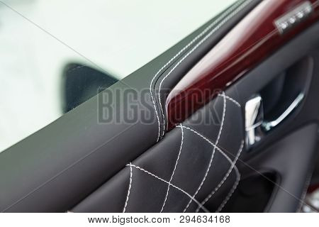Close-up Of Interior Of A Luxury Car With Leather Interior Overtightened Stitching In The Form Of A 