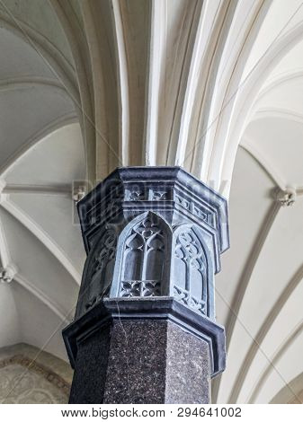 MALBORK, POLAND - 15 AUGUST, 2013: Gothic cloister column, Teutonic Malbork castle, Poland. Malbork castle is the largest brick fortress in the world