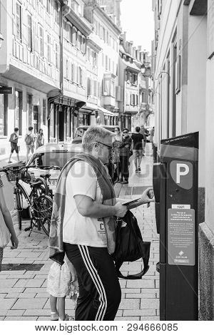 Strasbourg, France - Jul 22, 2017: Man Paying For Parking In Cetral Strasbourg At The Parking Meter 