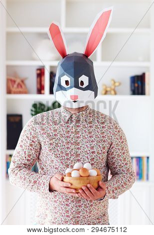 Young Aduly Bunny Rabbit Man Holding A Bowl Full Of Eggs At Home
