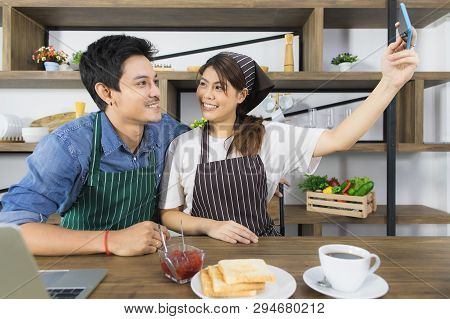Shot Of Happy Young And Beautiful Asian Couple In Love Enjoy Sharing Coffee Break Together In Modern