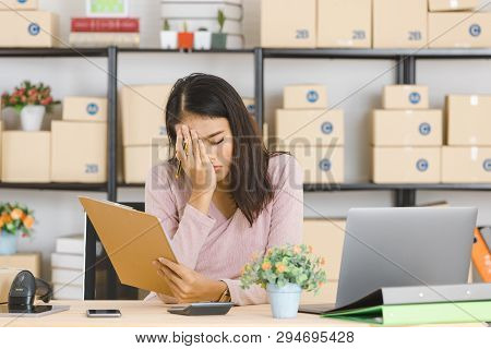 Shot Of Young And Beautiful Asian Business Lady In Casual Fashion Dress, Rechecking And Frowning On 