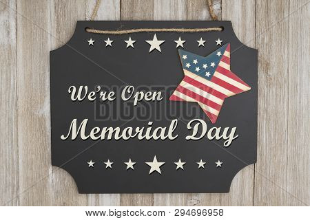 We Are Open Memorial Day Text On A Chalkboard With Patriotic Usa Red And Blue Star On Weathered Wood