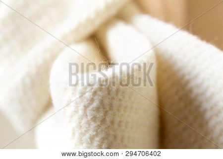 Close-up Of The White Ribbon Of Thick Material.coat Or Jacket.aterial.coat Or Jacket.