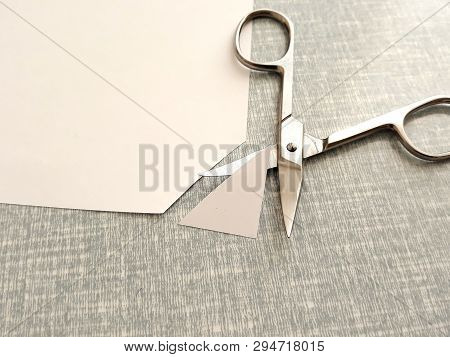Cutting Corners Idiom Briticism Hand Takes Sheet Of Paper And Cutting Corners By Scissors Doing Some