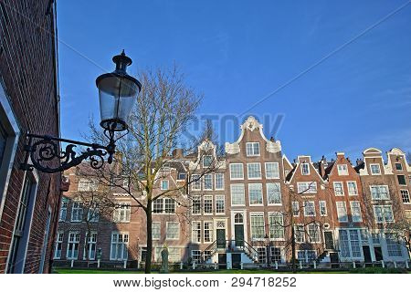 Amsterdam, Netherlands - April 05, 2019: The Internal Courtyard Of Begijnhof, One Of The Oldest Hofj