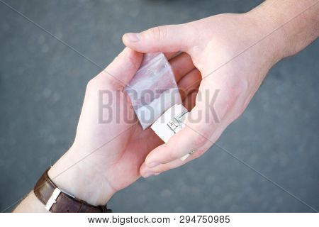 Drug Selling Concept. Close Up Hands, Trading Meth.