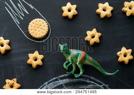 Plastic Dinosaur And Cookies On The Chalkboard, Play And Learning With The Children,  Dinosaurs Beca