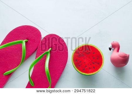 Pink Beach Flip Flops  And Squishy Toy Watermelon  And Flamingo  On White  Background Copy Space