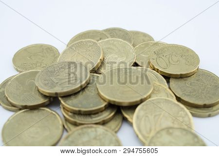 Several Twenty Euro Cent Coins On White Background. Coins With Little Value.