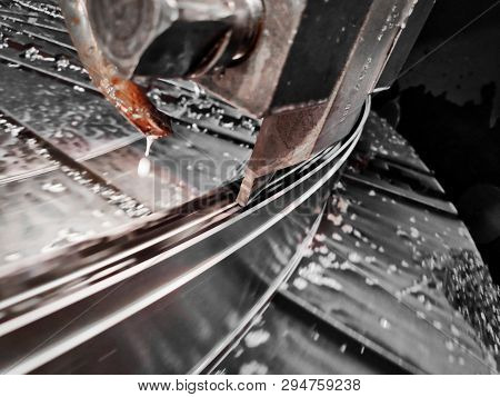 Photo Production Process Metal Processing With A Tool Cutter On A Circular Faceplate Of The Machine