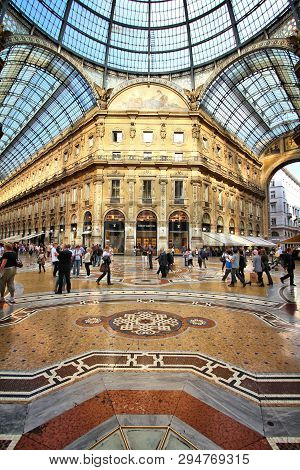 Milan, Italy - October 6, 2010: People Visit Vittorio Emanuele Ii Historic Shopping Arcade In Milan,
