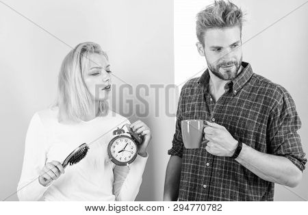 Too Early Awakening. Couple Oversleep Awakening Hold Alarm Clock. Couple Sleep Not Enough Time. Fami