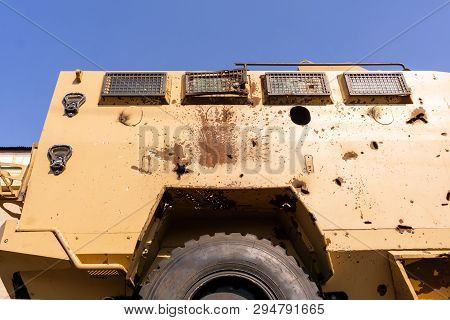 Holes From Bullets And Shell Fragments In The Body Of A Padded Armored Vehicle