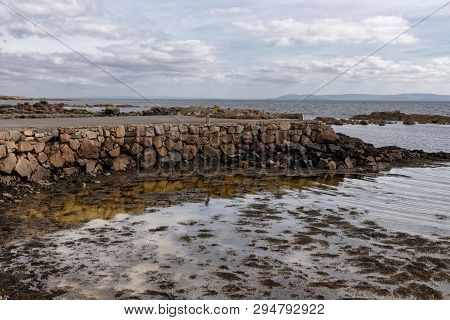 Pier And Beach In Galway Bay