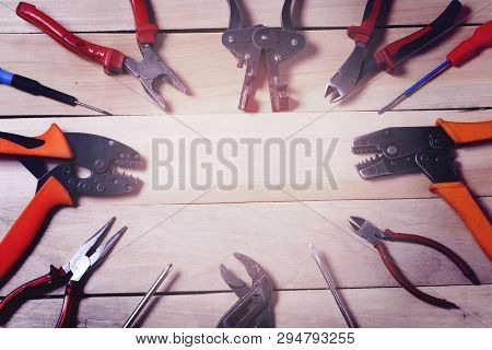 Electrical Tools On Wooden Surface With Place For Text.energy Concept