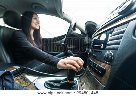 Woman Driver Shifting The Gear Stick And Driving A Car