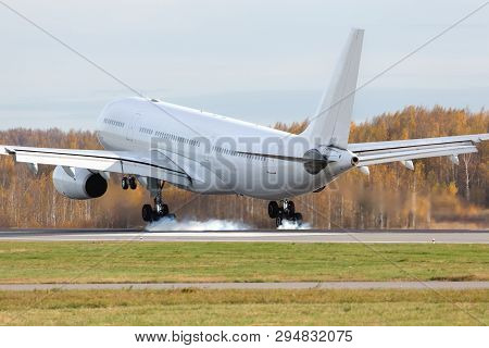 Wide-body Airplane Landing On Runway With Smoke From Chassis, Back View/ Touchdown With Landing Gear