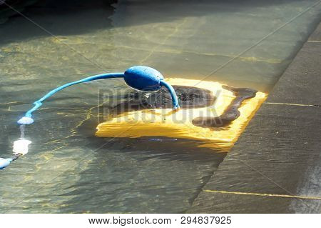 Pool Cleaner During His Work. Cleaning Robot For Cleaning The Botton Of Swimming Pools.