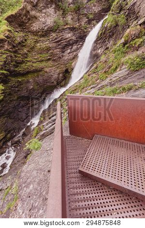 Staircase To Walk Up To Svandalsfossen In Norway, Waterfall In Norwegian Mountains. National Tourist