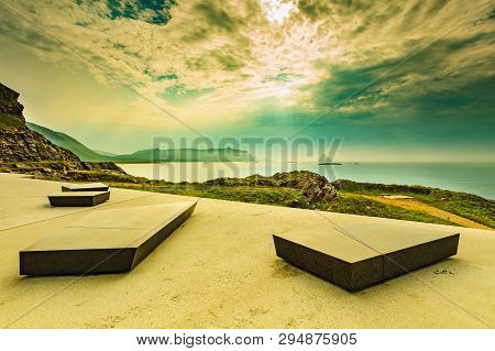 Kleivodden Rest Stop Area Viewpoint With Stone Seating Bench. Arctic Ocean View With Clouds Sky. Att