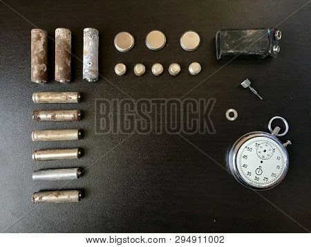 Corrosion-free Batteries.  Different Size And Shape.  A Broken Stopwatch. Recycling And Environmenta