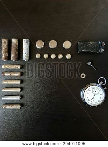 Corrosion-free Batteries.  Different Size And Shape.  A Broken Stopwatch. Recycling And Environmenta