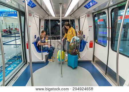 Dubai, Uae - March 27. 2019. People In Train In The Dxb Airport Arrival Terminal