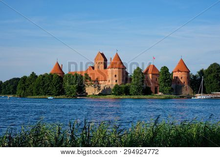 Trakai Island Castle in lake Galve in day, Lithuania. Trakai Castle is one of major tourist attractions of Lituania