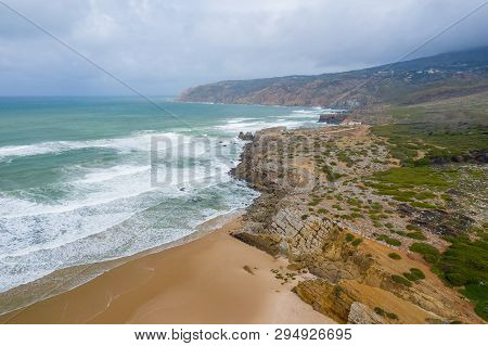 Aerial View Of Famous Guincho Beach In Cascais Near Lisbon, Portugal. Photo Made From Above By Drone