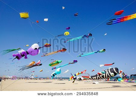 Cervia, Italy, April 2018: Many Colorful Kites In Different Shapes At Cervia International Kite Fest