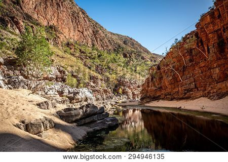Bottom Landscape View Of Ormiston Gorge In The West Macdonnell Ranges With Waterhole And Cliffs In N