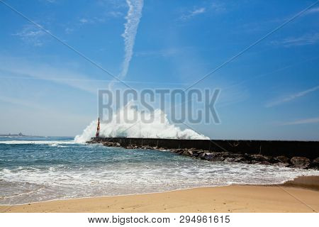 Ocean surf at the lighthouse, a giant wave.
