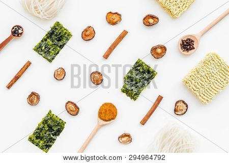 Japanese Food Cooking With Seaweed, Spices, Pepper, Mushrooms And Noodles On White Background Top Vi