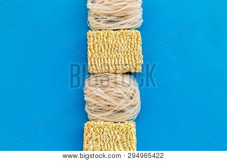 Rice Vermicelli, Noodles To Cook Chinese And Japanese Food Design On Blue Background Top View Copy S