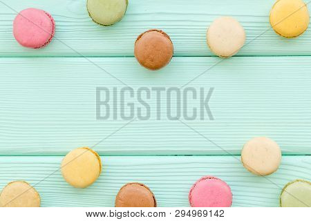 Brignt Macarons Frame For Sweet Break On Mint Green Background Top View Mock Up