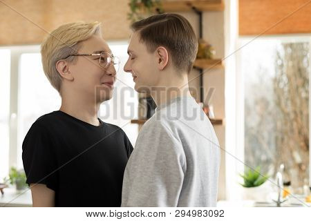 Close Up Portrait Of Two Young International Gay Men In Casual Clothes, One Asian Blonde Men In Eyeg