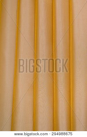 Vertical Folds On Lightish Organza Curtains For Background And Design