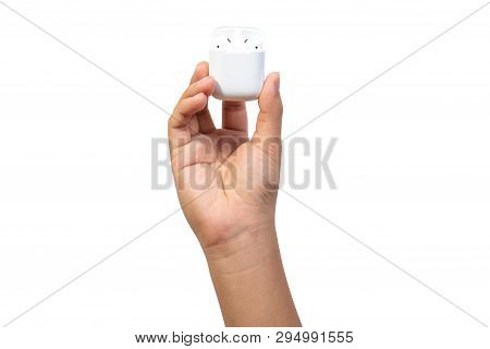 White Wireless Earphones In-ear Or Earbud Bluetooth With Charging Case Holding In Hand Isolated On W