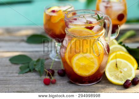 Homemade Refreshing Drink. Wine Sangria Or Punch With Fruits In Glasses, Cocktails With Fresh Fruits