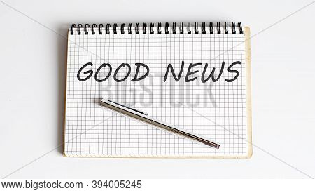 Notebook With Pen And Notes About Good News, Business