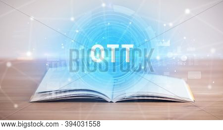 Open book with OTT abbreviation, modern technology concept