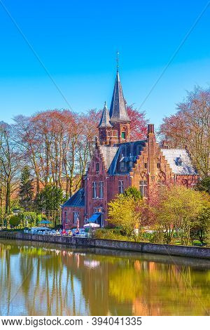 Bruges, Belgium Minnewater Lake Of Love Panorama, Lovers Bridge, Castle Cafe, Blue Sky