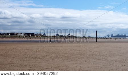 Southport, Merseyside, United Kingdom - 10 September 2020: People Walking On The Beach At Blundell S