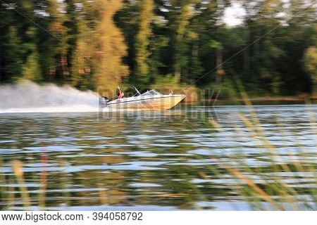 Uralsk, Kazakhstan - July 17 2014: Boat With Tourists At High Speed Floating On The River